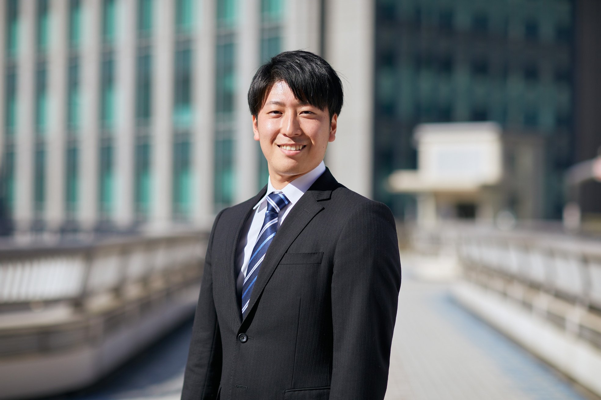 Smiling Japanese Businessman in a Suit