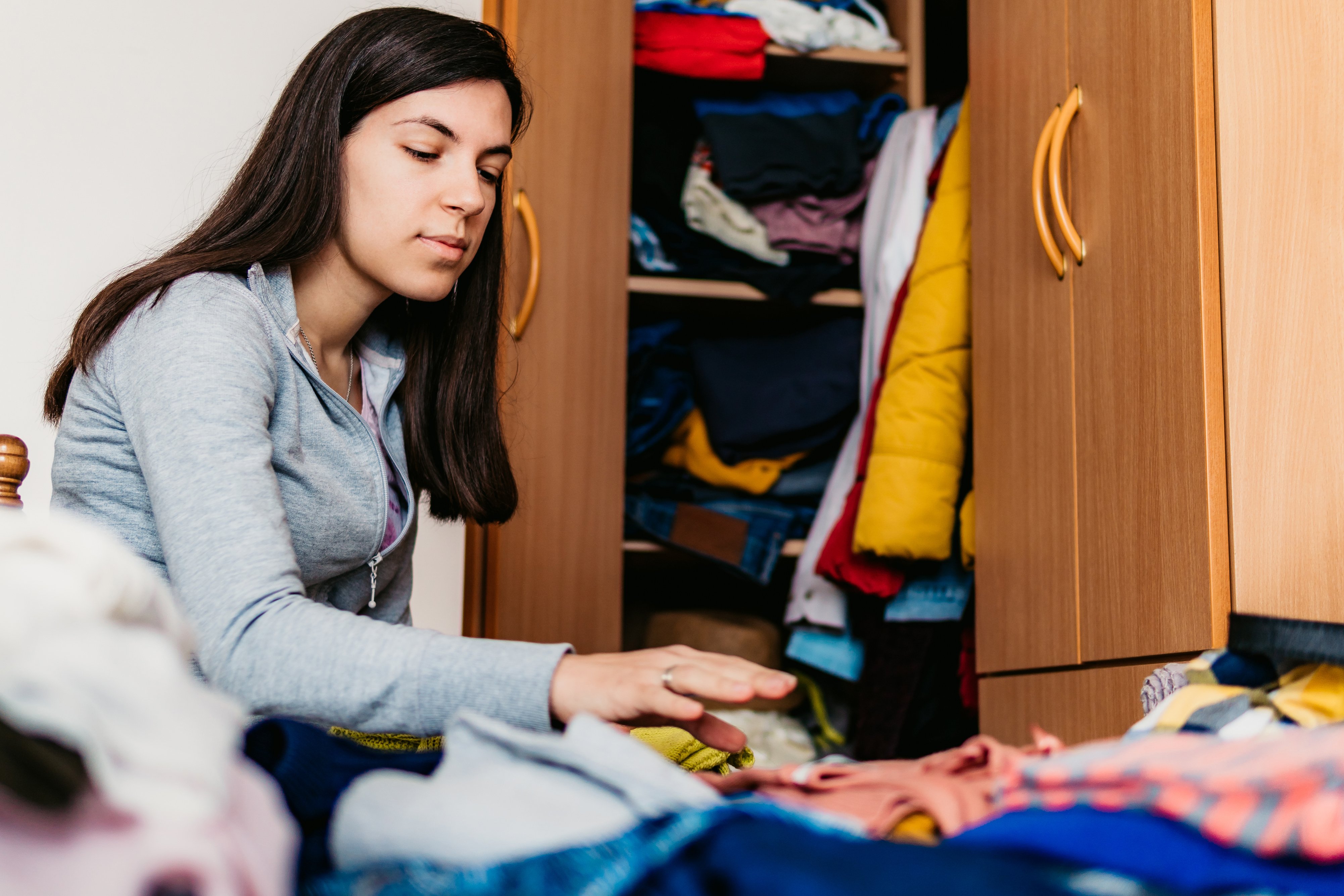 Woman sorting out wardrobe